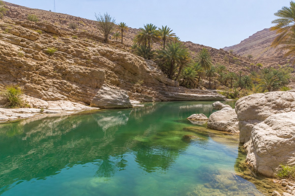 The emerald pools of Wadi Bani Khalid, a common stop on a Wahiba Sands day trip from Muscat