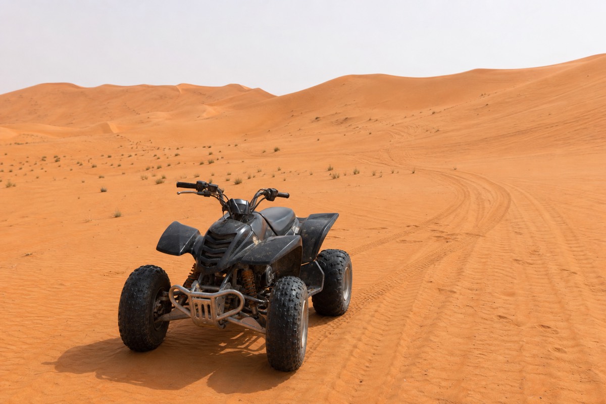 A quad bike parked on a Wahiba Sands dune, an option for those exploring Wahiba Sands without a tour