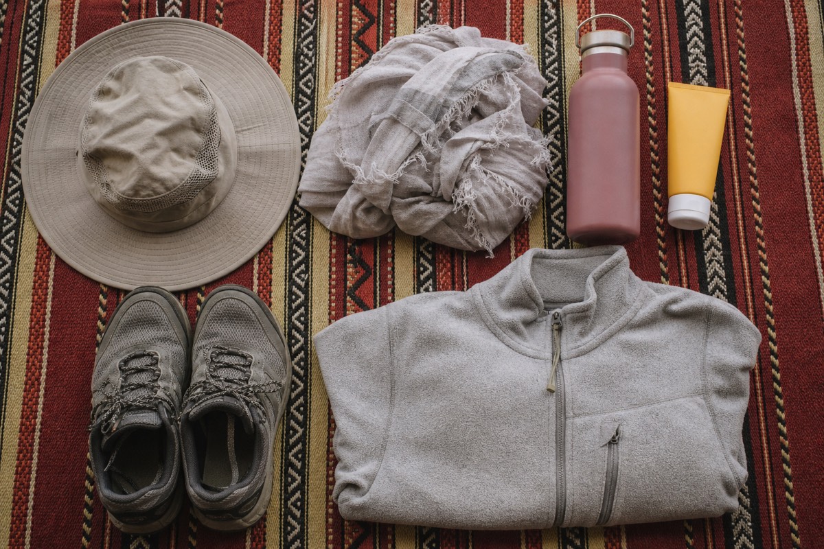 Flatlay of recovery gear to pack for self-drive Wahiba Sands, including a compressor and deflator